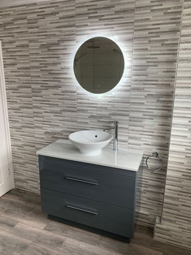 Ellera Circular LED Mirror. Italian Riflessi Muretto Grigio Wall Tiles.